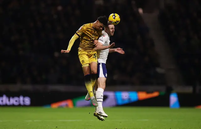 Kristi Montgomery of Blackburn Rovers wins a header over Ben Whiteman of Preston North End