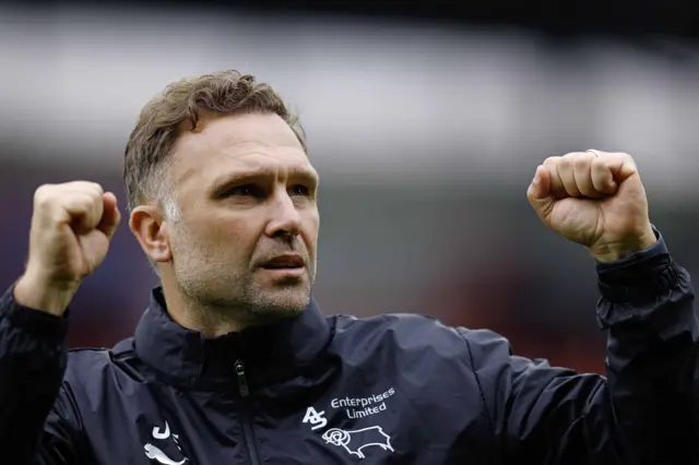 Derby boss John Eustace with his first in the air in celebration