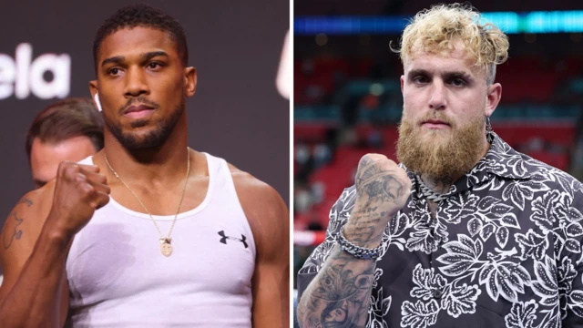 Anthony Joshua and Jake Paul hold up their fist