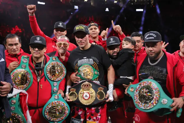 David Benavidez poses with his team and they are hold the WBC world titles