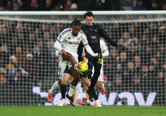 Fulham's Alex Iwobi in action with Sunderland's Enzo Le Fee