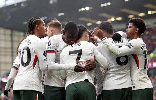 Pedro Neto of Chelsea celebrates scoring his team's first goal with teammates during the Premier League match between Burnley and Chelsea at Turf Moor on November 22, 2025 in Burnley, England.