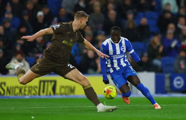 Brighton & Hove Albion's Yankuba Minteh in action with Brentford's Kristoffer Ajer.