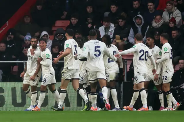 West Ham United's Callum Wilson celebrates scoring their first goal with teammates.