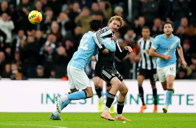 Manchester City's Josko Gvardiol fouls Newcastle United's Nick Woltemade (centre right) during the Premier League match at St James' Park, Newcastle.