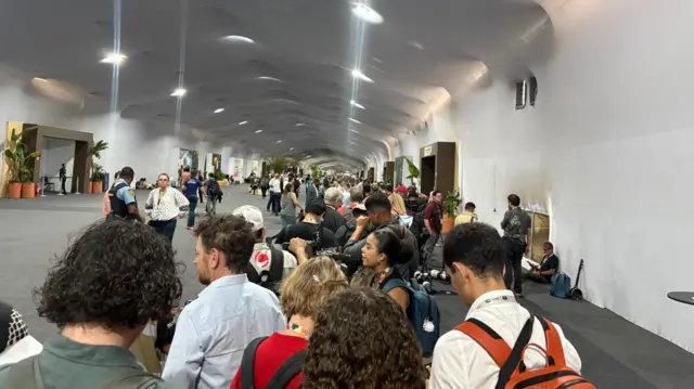 Queues of journalists wait at COP30