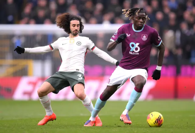 Burnley's Lesley Ugochukwu (right) and Chelsea's Marc Cucurella battle for the ball during the Premier League match at Turf Moor, Burnley.