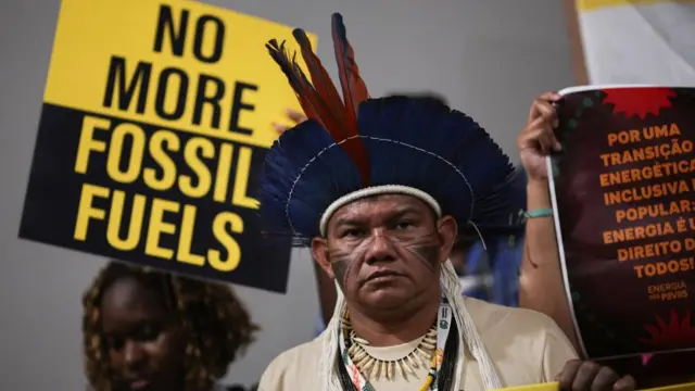 Indigenous people protest against fossil fuels during COP30