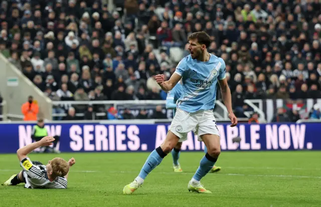 Manchester City's Ruben Dias celebrates scoring their first goal.