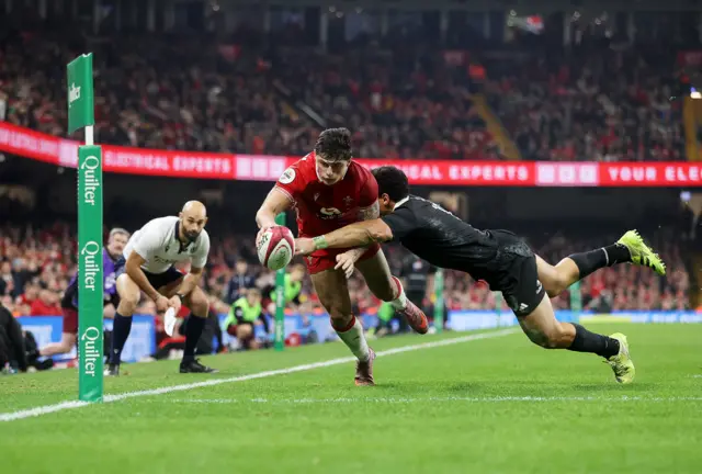 Louis Rees-Zammit dives over to score for Wales against New Zealand in Cardiff