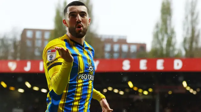 Finn Azaz celebrates scoring