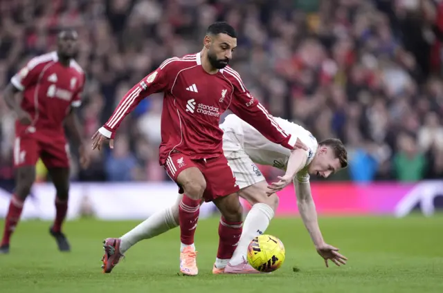 Description Liverpool's Mohamed Salah (left) and Nottingham Forest's Elliot Anderson battle for the ball during the Premier League match at Anfield, Liverpool.