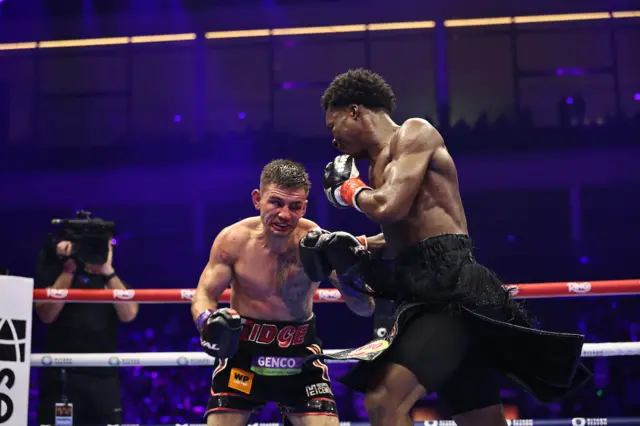 Mason throws a punch at Noakes