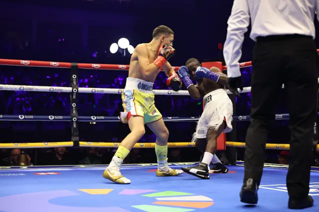 Juan El Guerito de Tepito lands a punch on Barker Ssewanyana