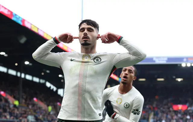 Pedro Neto of Chelsea celebrates scoring his team's first goal during the Premier League match between Burnley and Chelsea at Turf Moor on November 22, 2025 in Burnley, England.