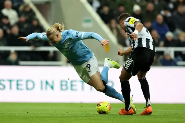 Manchester City's Erling Haaland in action with Newcastle United's Malick Thiaw