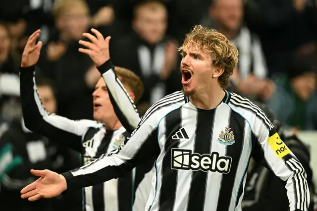 Newcastle United's German striker #27 Nick Woltemade (R) and Newcastle United's English midfielder #11 Harvey Barnes (L) celebrates their second goal during the English Premier League football match between Newcastle United and Manchester City at St James' Park in Newcastle-upon-Tyne, north east England on November 22, 2025.