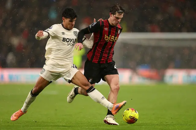 Alex Scott of AFC Bournemouth is challenged by Mateus Fernandes of West Ham United during the Premier League match between Bournemouth and West Ham United at Vitality Stadium on November 22, 2025 in Bournemouth, England.