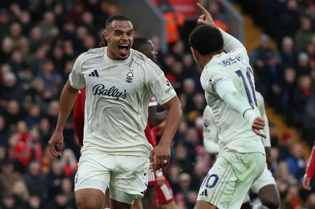 Nottingham Forest's Brazilian defender #05 Murillo (L) celebrates with teammate Nottingham Forest's English midfielder #10 Morgan Gibbs-White (R) after scoring the team's first goal during the English Premier League football match between Liverpool and Nottingham Forest at Anfield in Liverpool, north west England on November 22, 2025.