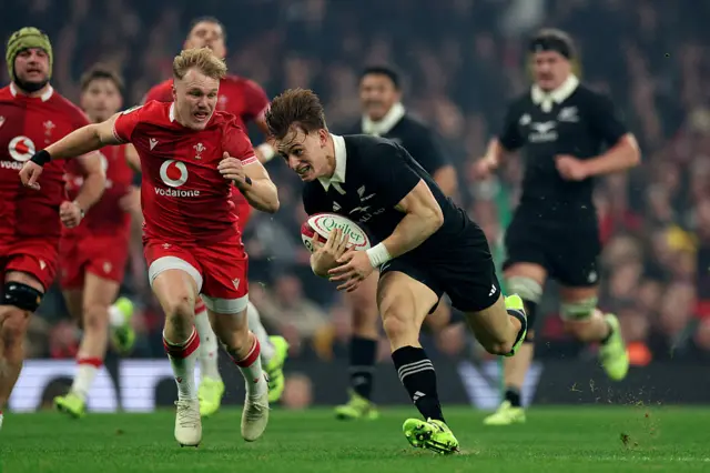 Ruben Love runs to score a try