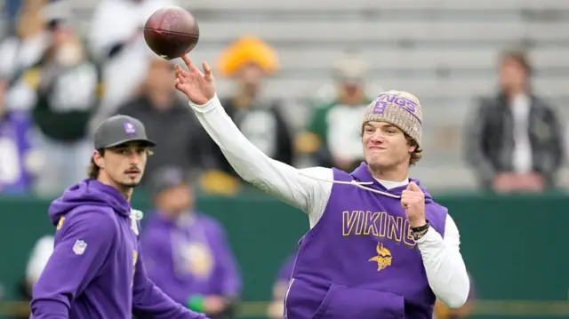 JJ McCarthy throws the ball pre-match at Lambeau Field.