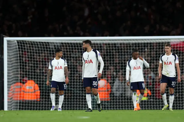 Rodrigo Bentancur of Tottenham Hotspur reacts after his team conceded a goal during the Premier League match between Arsenal and Tottenham Hotspur at Emirates Stadium on November 23, 2025 in London, England.