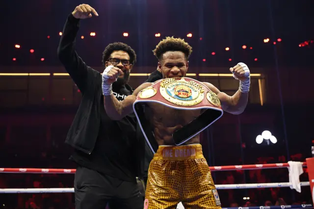 Devin Haney bites into his world title