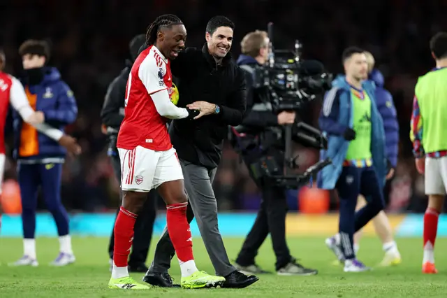 Mikel Arteta, Manager of Arsenal, celebrates with Eberechi Eze of Arsenal as he holds the match ball after scoring a hat-rick following the Premier League match between Arsenal and Tottenham Hotspur at Emirates Stadium on November 23, 2025 in London, England.