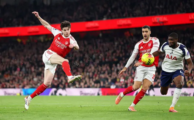 Declan Rice of Arsenal shoots during the Premier League match between Arsenal and Tottenham Hotspur at Emirates Stadium on November 23, 2025 in London, England.