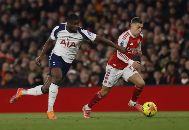 Tottenham Hotspur's Kevin Danso in action with Arsenal's Leandro Trossard