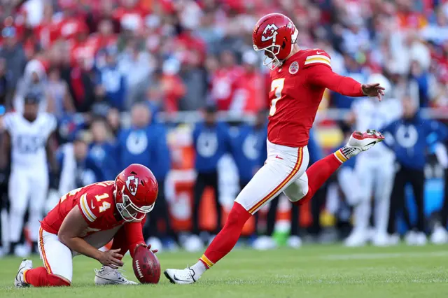Harrison Butker takes a kick for the Kansas City Chiefs