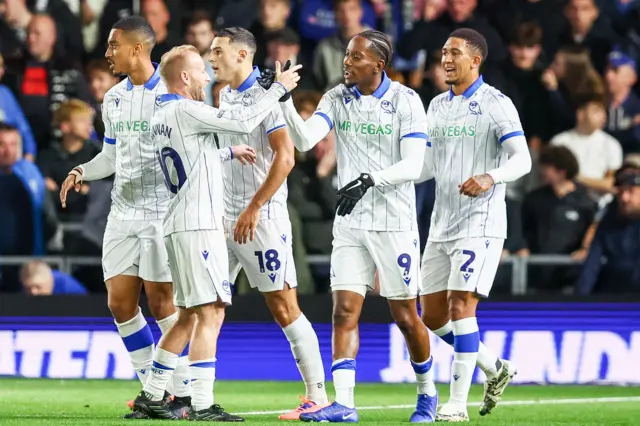 Shefield Wednesday players celebrate scoring a goal at Birmingham