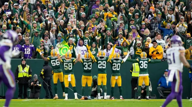 The Green Bay Packers' defence celebrates an interception against the Minnesota Vikings