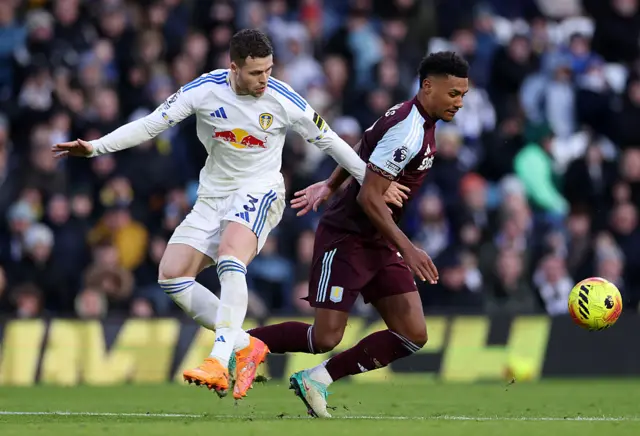Gabriel Gudmundsson of Leeds United battles for possession with Ollie Watkins of Aston Villa during the Premier League match between Leeds United and Aston Villa at Elland Road on November 23, 2025 in Leeds, England.