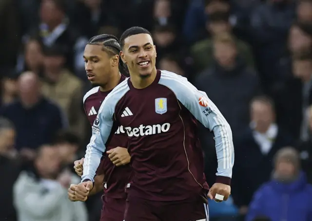 Aston Villa's Morgan Rogers celebrates scoring their first goal with Boubacar Kamara.