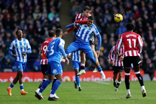Sydie Peck of Sheffield United competes for an aerial ball against Yan Valery of Sheffield Wednesday