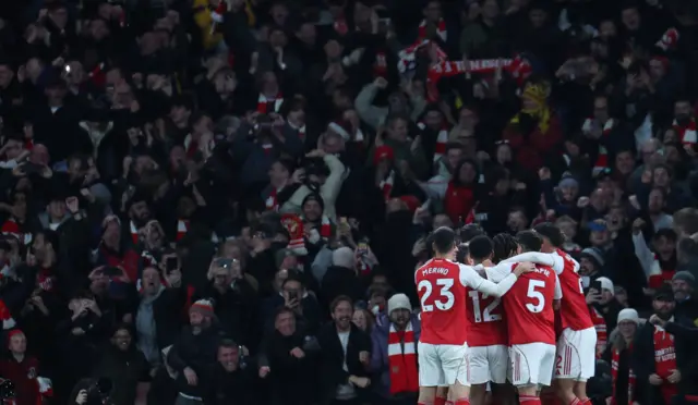 Arsenal's Eberechi Eze celebrates scoring their second goal with teammates.