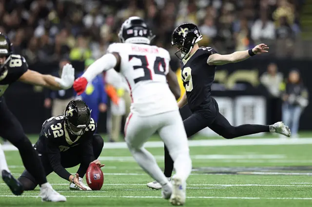 Blake Grupe takes a field goal for the Saints against the Atlanta Falcons