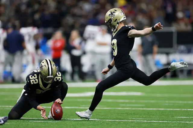 Blake Grupe takes a field goal for the Saints