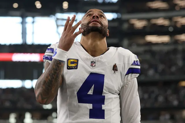 Dak Prescott looking up in the air and looks frustrated.