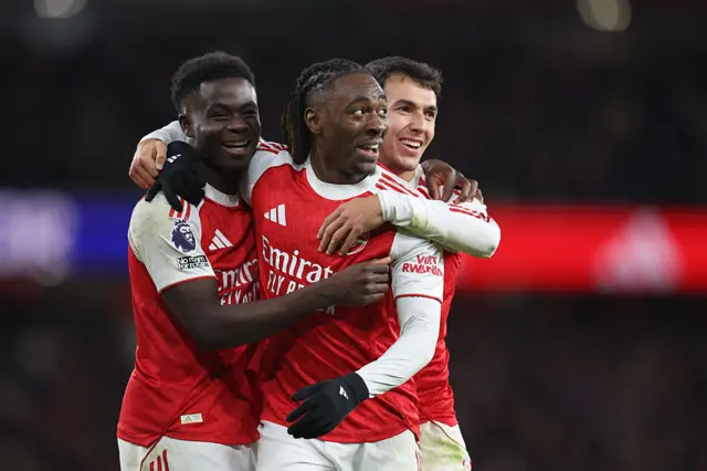 Eberechi Eze of Arsenal celebrates his third goal with Bukayo Saka and Martín Zubimendi (right) during the Premier League match between Arsenal and Tottenham Hotspur at Emirates Stadium on November 23, 2025 in London, England.