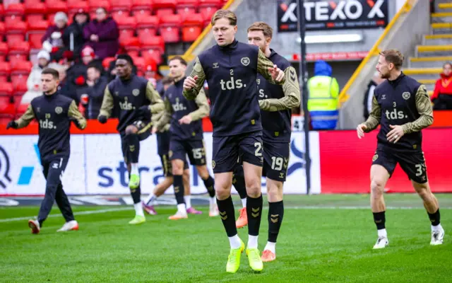 Hearts players warming up at Pittodrie