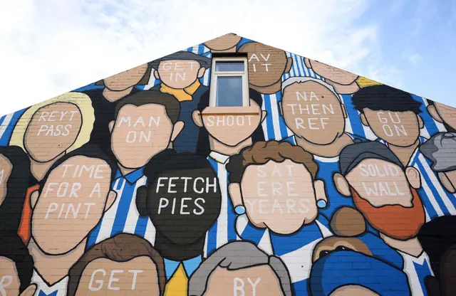A Sheffield Wednesday mural is seen outside the stadium