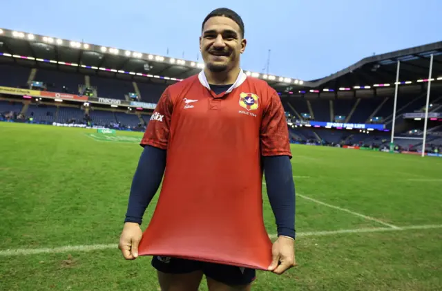 Sione Tuipulotu with Tonga jersey