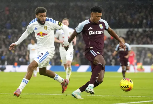 Leeds United's Jayden Bogle (left) and Aston Villa's Ollie Watkins battle for the ball during the Premier League match at Elland Road, Leeds.