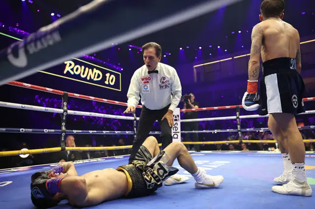 Jesse Rodriguez stands over Fernando Martinez