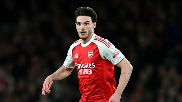 Declan Rice of Arsenal runs with the ball during the Premier League match between Arsenal and Tottenham Hotspur at Emirates Stadium on November 23, 2025 in London, England.