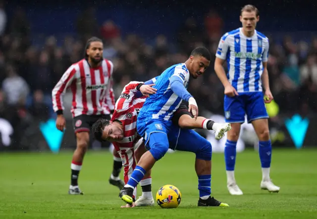 Sheffield United's Callum O'Hare (left) and Sheffield Wednesday's Yan Valery