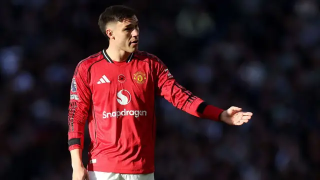 Manuel Ugarte gestures to his teammates