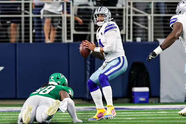 Dak Prescott drops back and readies himself to throw the ball